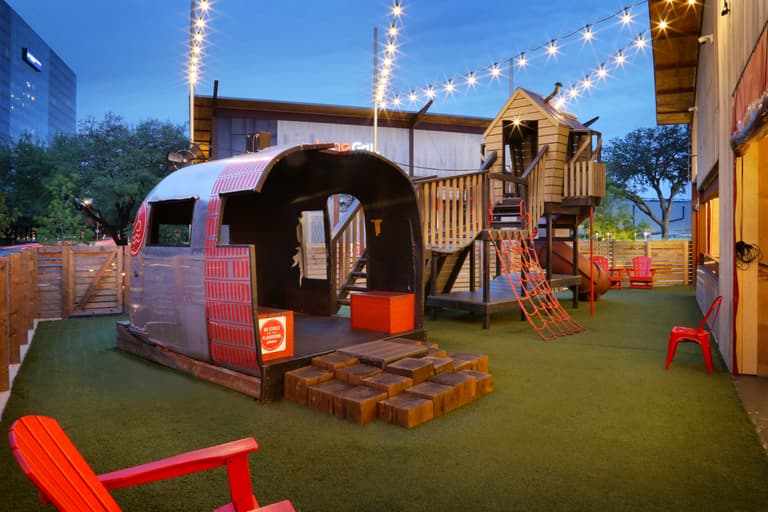 kids playground area with jungle gym and turf